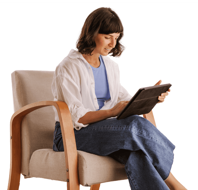 woman sitting in chair and interacting with kama.ai chat on a tablet