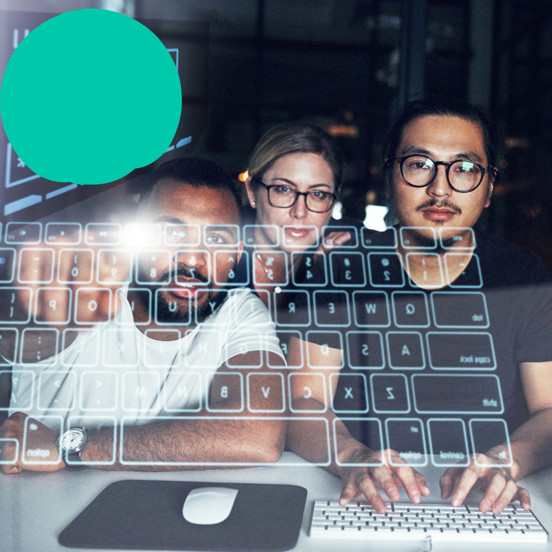 three people looking at the screen and one person is typing on a keyboard