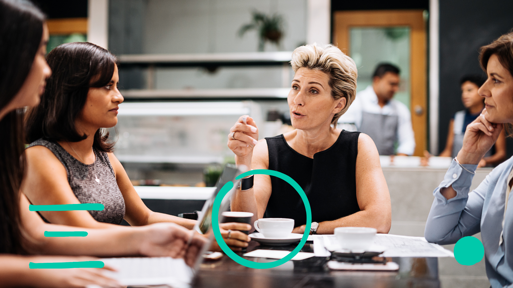 women sitting around a table in discussion