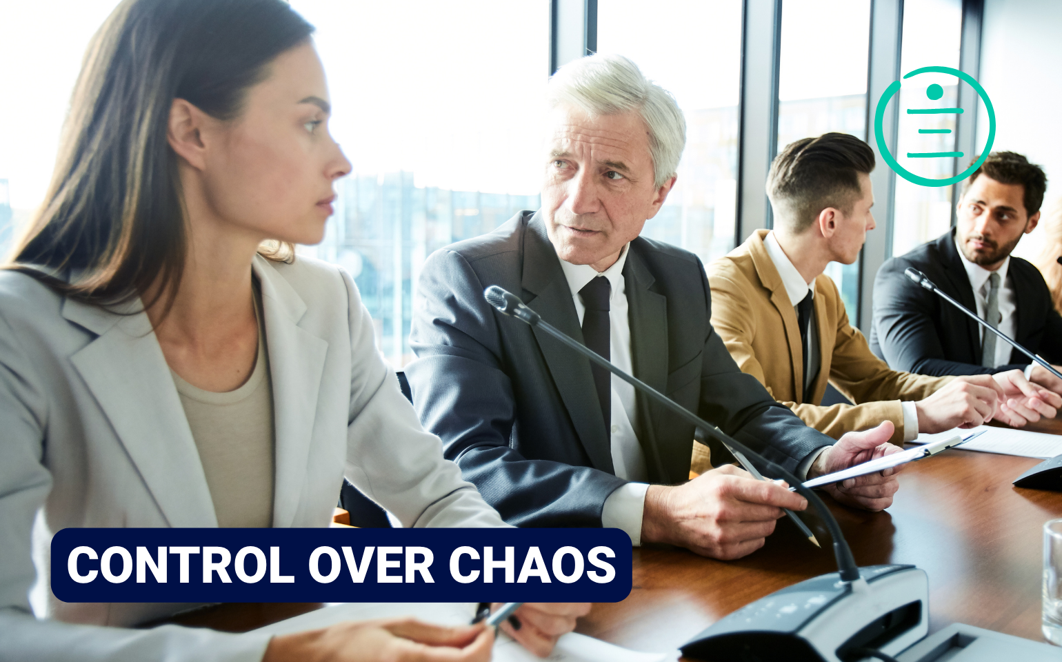 People in a boardroom meeting around a conference table, with one person speaking while others listen and sign papers. With the caption: Control over chaos